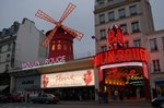 Moulin Rouge nightclub in the Pigalle district, founded in 1889, known for its scantily clad chorus girls.